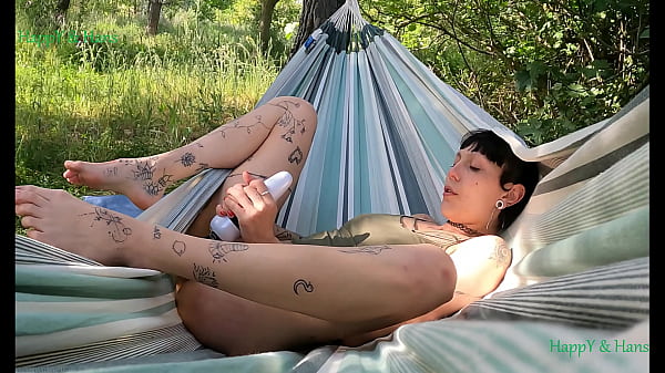 HappY satisfying herself in the hammock. Outdoors in nature. The stain, Spain.