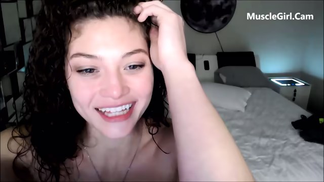 Young muscle girl flexing