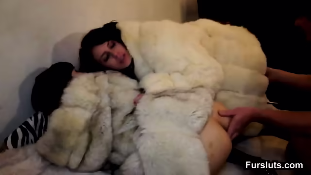 Two Brunettes Fucked In White Fur Coat
