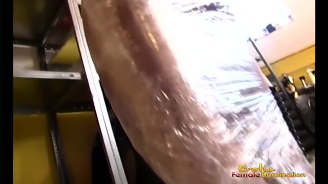 Mistress wraps female slave in cling film